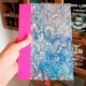 Cuaderno con lomo de tela fucsia Papel de agua Azul
